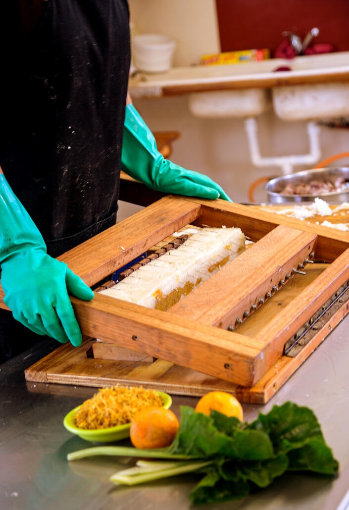 Soap cutting handmade natural soap in a kitchen setting